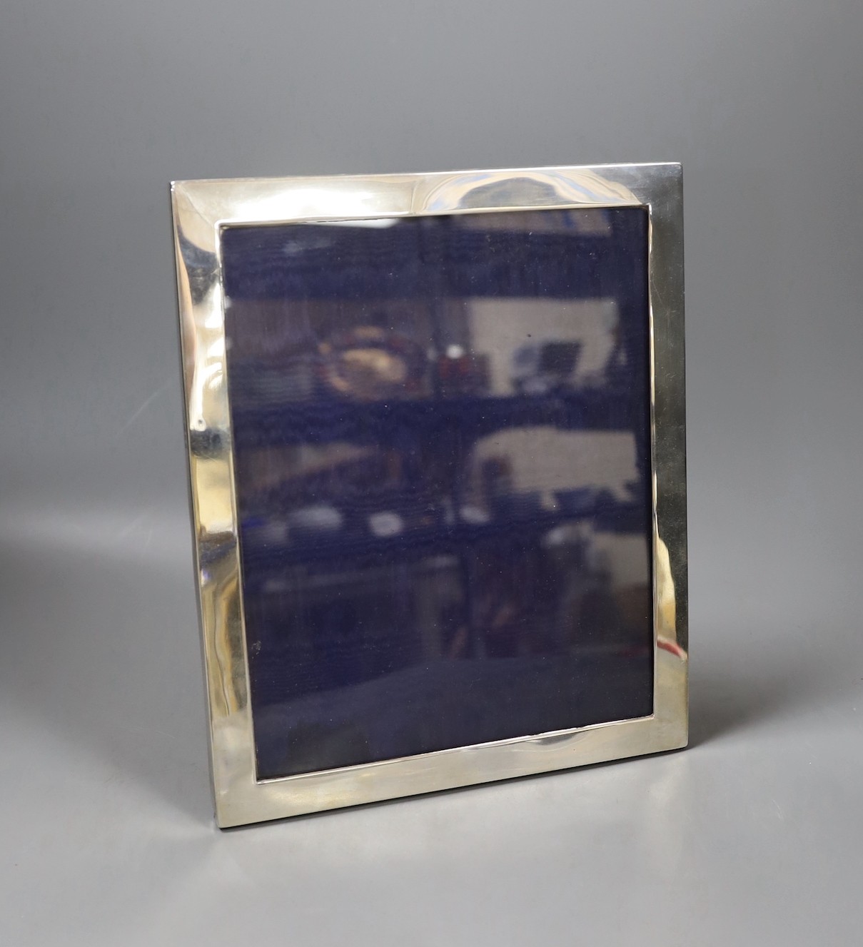A George V silver mounted rectangular photograph frame, PS & Co, London, 1925, overall 29.2cm by 24.4cm.